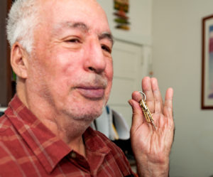 Photo of senior citizen holding a key