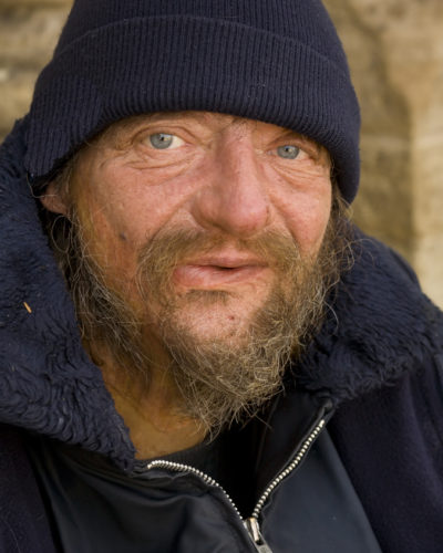 Photo of homeless man in hat