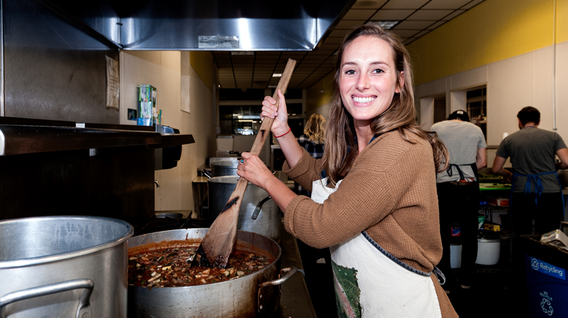 Photo of happy volunteer cooking